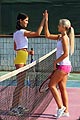 A two girls, blonde and brunette, in yellow and pink shorts playing tennis and then fucking each other.