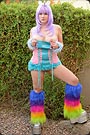 She is wearing a techno dance dress because she likes rave music.